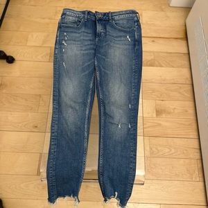 Zara women’s ripped jeans at the bottom